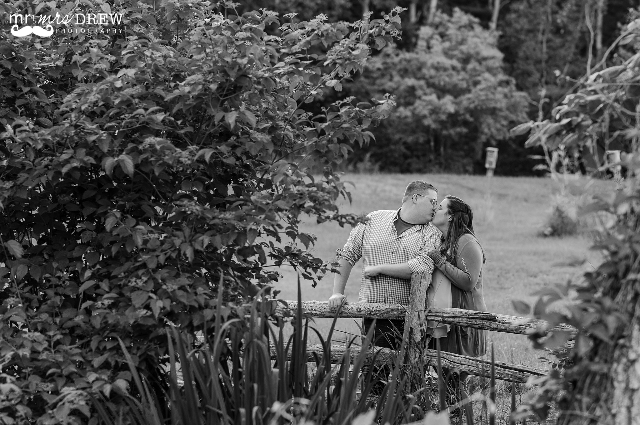 Black and White image of couple kissing. Red Wing Farm Engagement Session Chelmsford