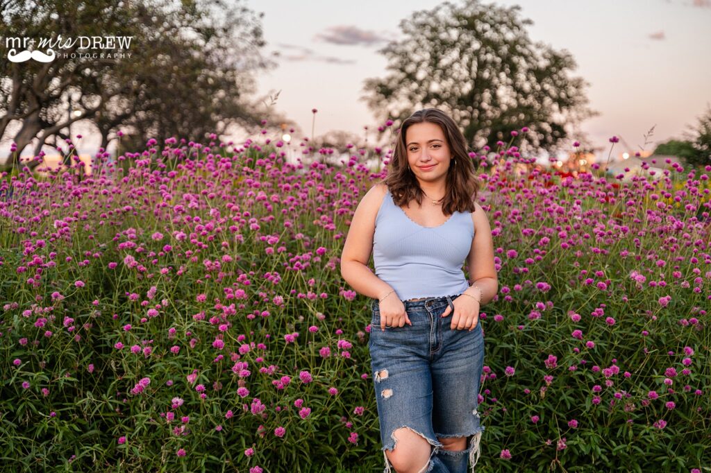 senior portraits surrounded by pink flowers