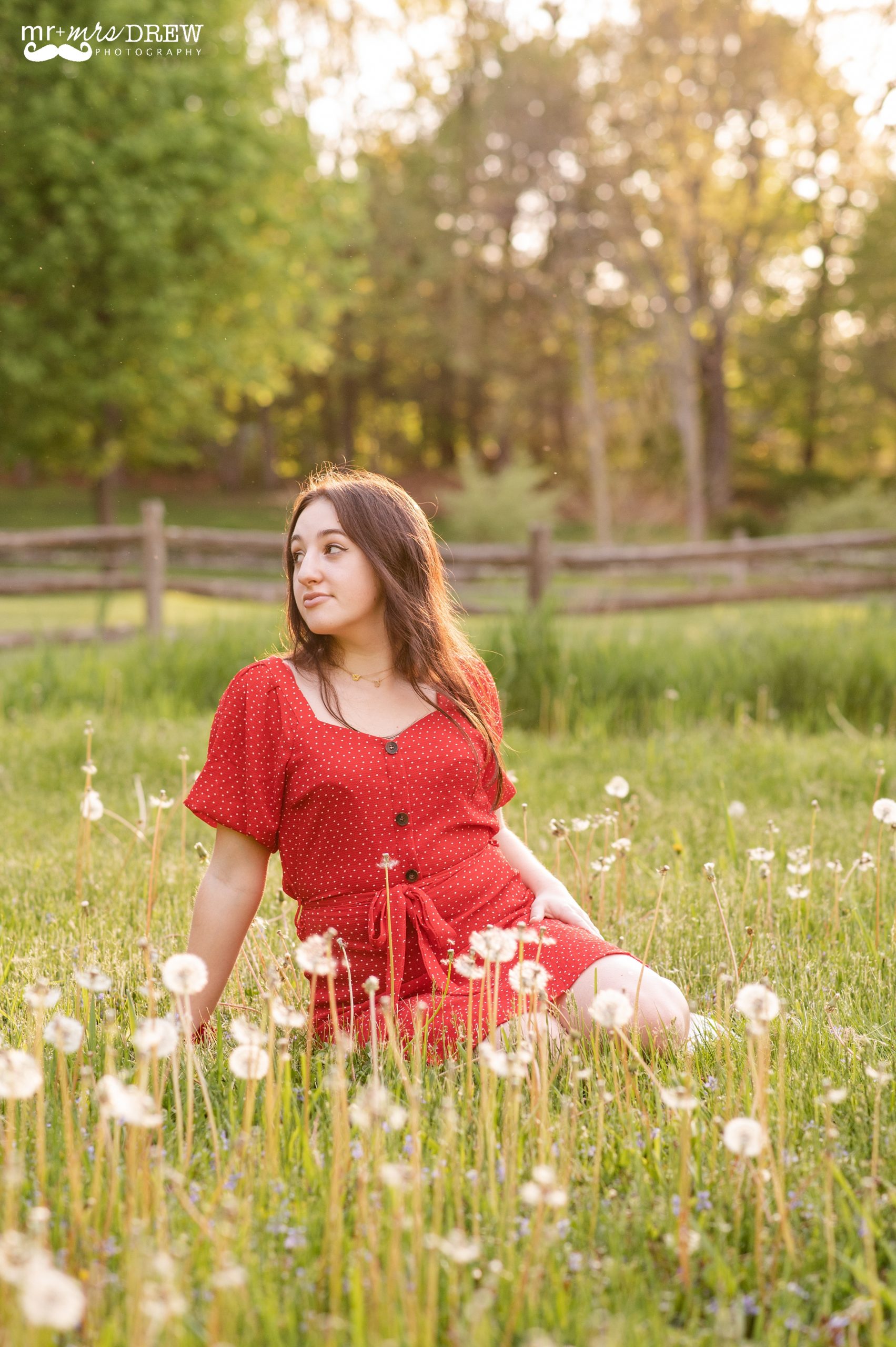Senior photos in field with white flowers