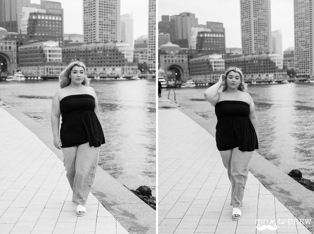 Black and white Boston senior portrait at Fan Pier Park with the Boston skyline in the background.